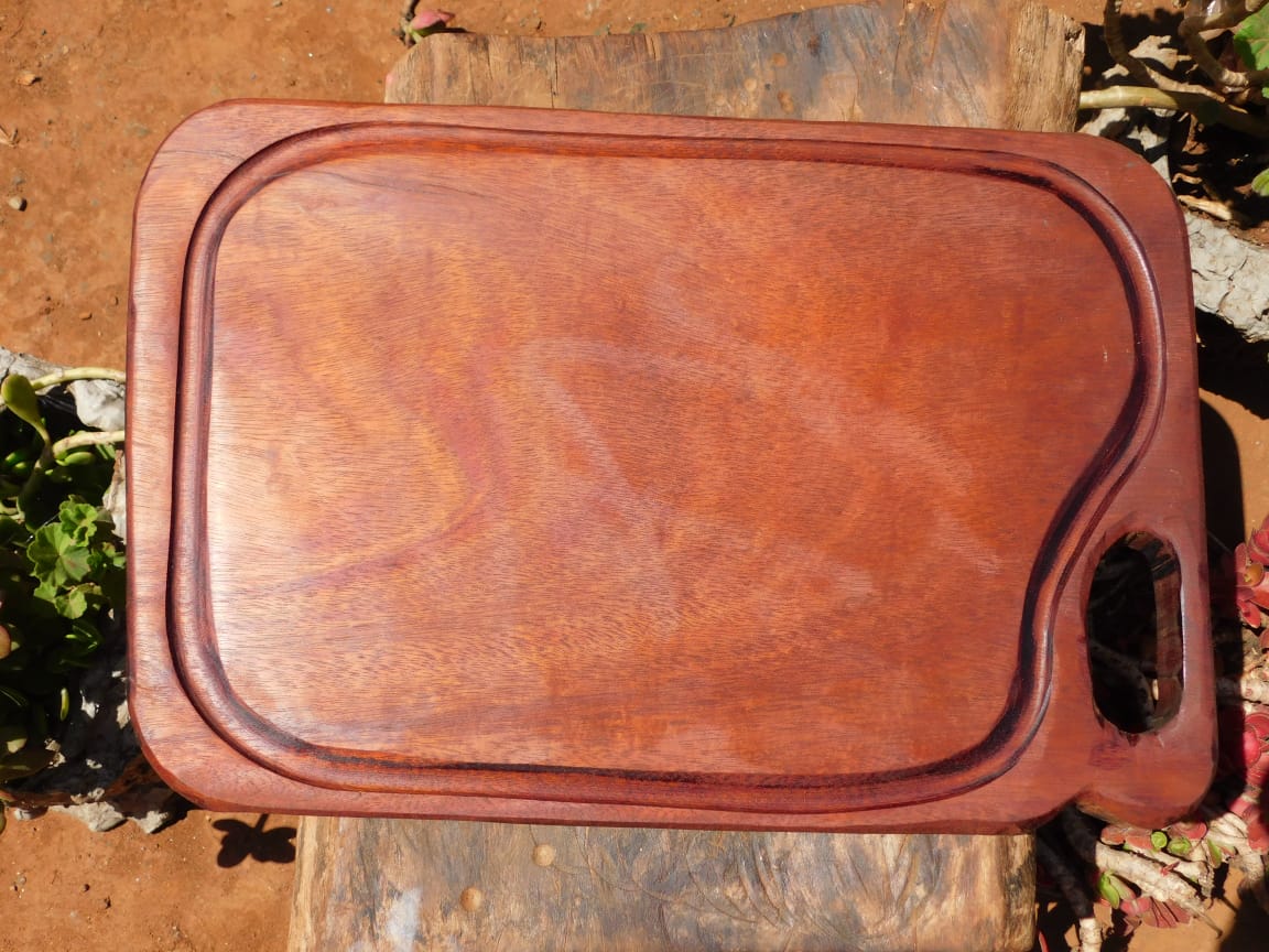 Hand-Shaped Artisan African Mahogany Cutting board with Groove